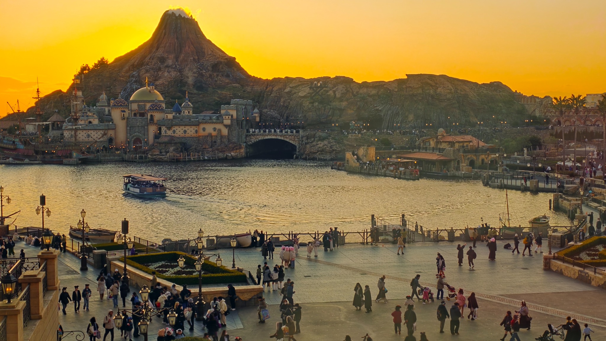 The harbor and volcano in the evening light, seen from our third-floor Harbor View room in the central building in 2025